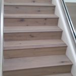 Natural colored hardwood flooring installation for stairs