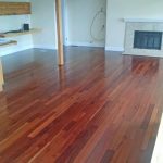 Red tinted wood flooring installation